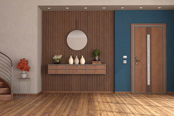 Entryway design with wood wall paneling, floating shelf, and minimalist decor.