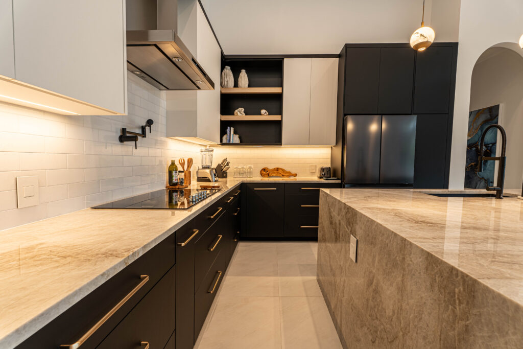 Modern kitchen with vertical subway tile backsplash and wood accents.